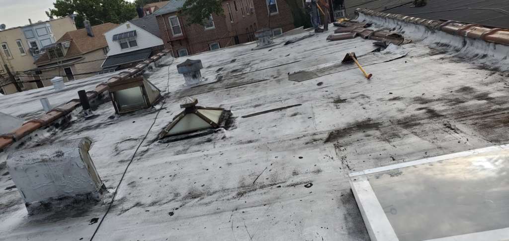 Flat Roof Installation, New Skylight, New Gutters and New Shingle Project Shot 5