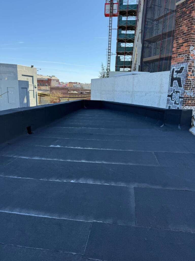 New Rubber Layer on Commercial Flat Roof Installation in Queens Project Shot 6