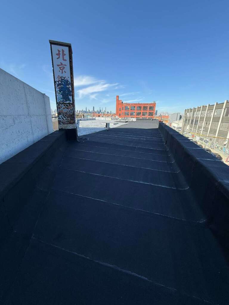 New Rubber Layer on Commercial Flat Roof Installation in Queens Project Shot 7