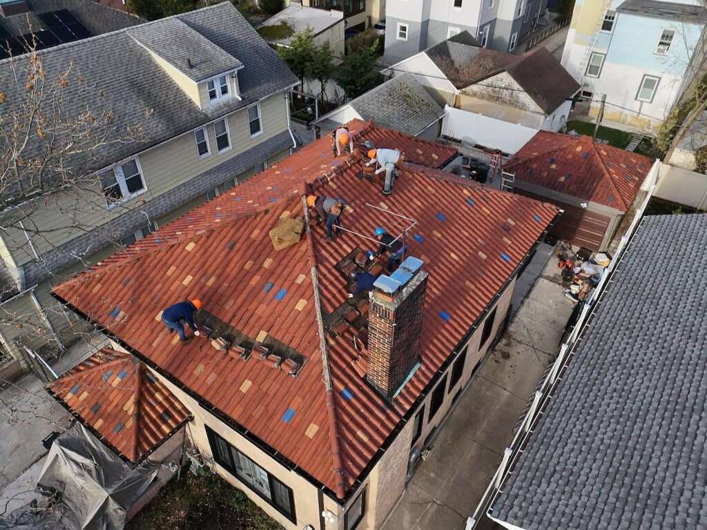 Remove Spanish Tile Roof, Install Shingle Roof, Skylight, Soffit & Gutter in Queens - Detail 2