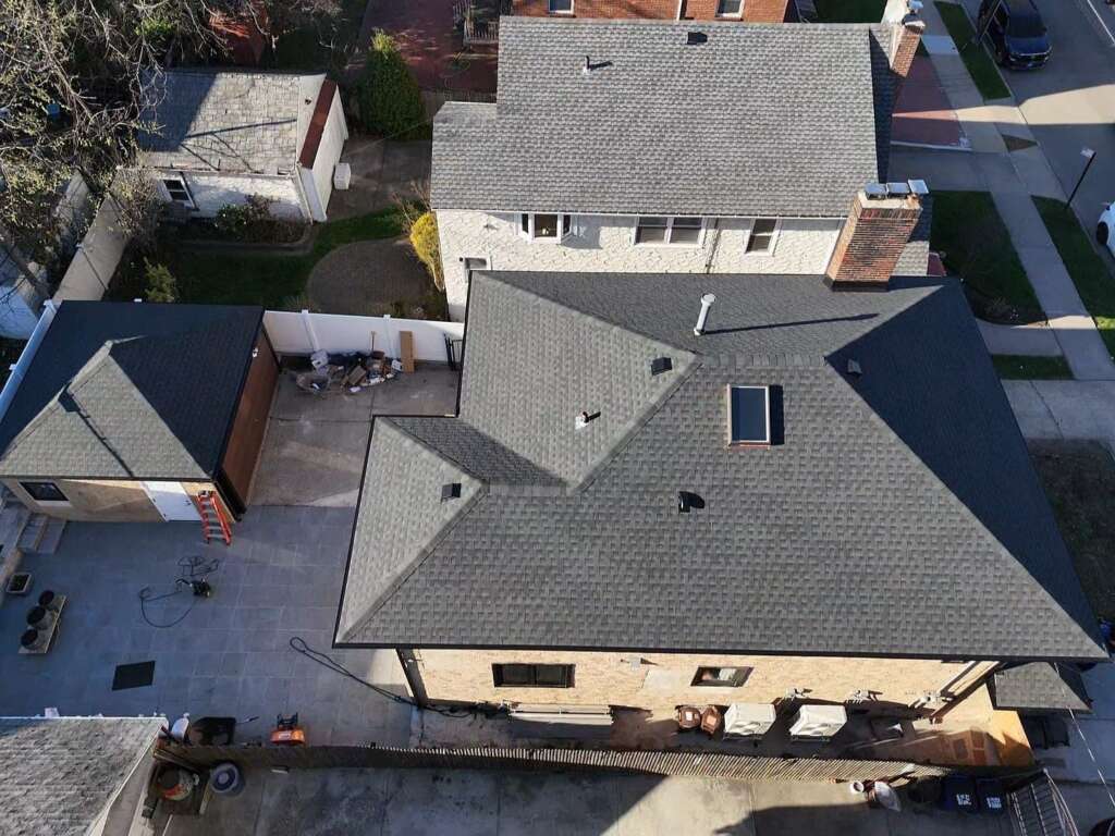 Remove Spanish Tile Roof, Install Shingle Roof, Skylight, Soffit & Gutter in Queens - Detail 1