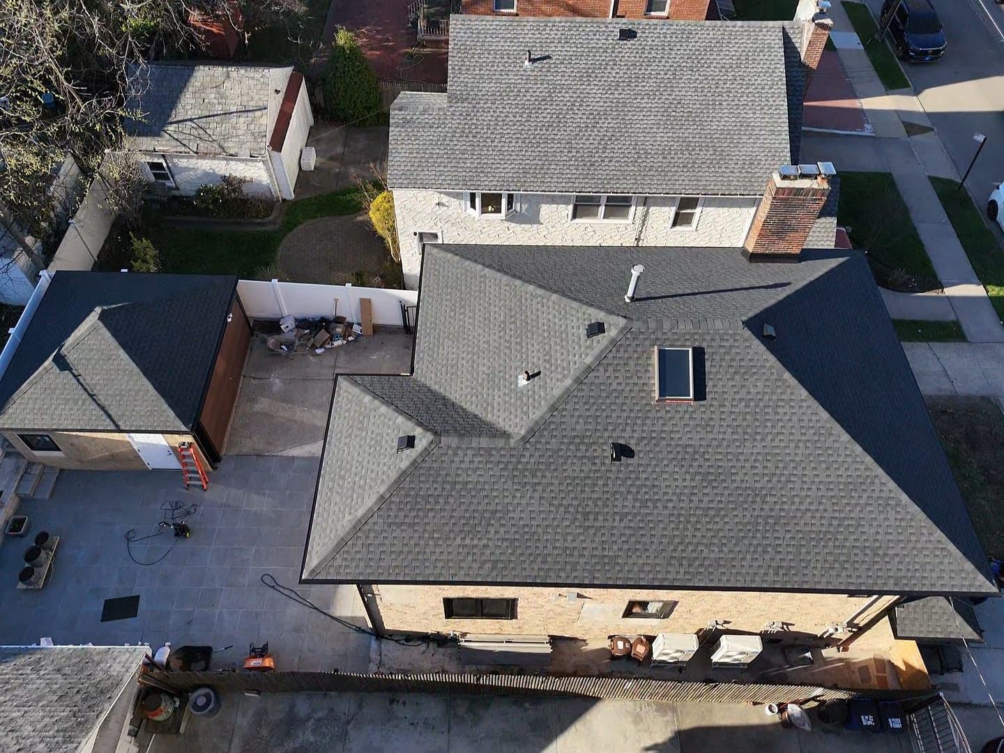 Remove Spanish Tile Roof, Install Shingle Roof, Skylight, Soffit & Gutter in Queens