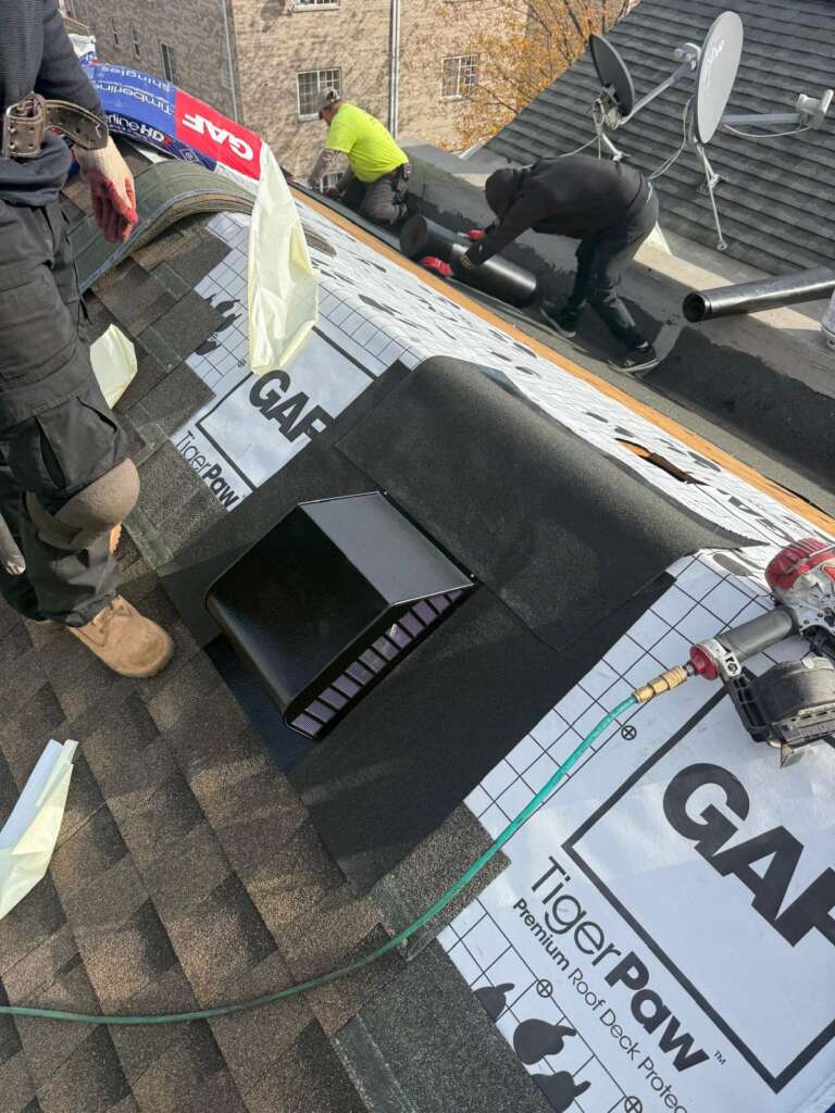 Shingle roof installation in progress in Throgs Neck, Bronx. Roofing team removing old shingles, preparing roof deck, and installing underlayment for durable and long-lasting results.