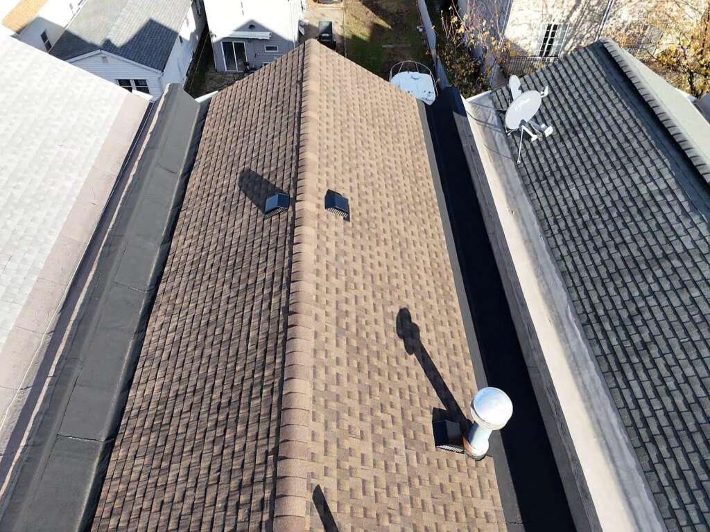 Completed new shingle roof installation in Throgs Neck, Bronx. High-quality shingle roofing system installed by Home Team Construction for maximum durability and protection.