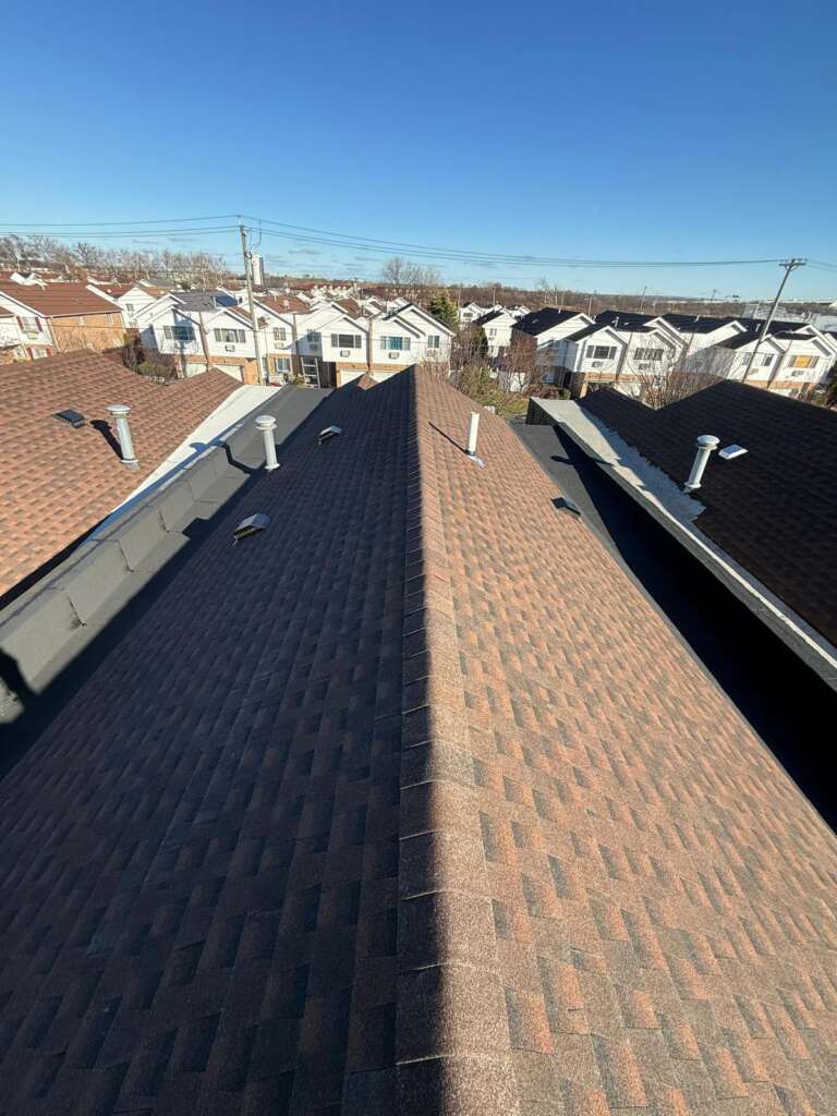 Completed new shingle roof installation at Castle Hill, Bronx (ZIP 10473). High-quality shingle roofing system installed by Home Team Construction for maximum durability and protection.