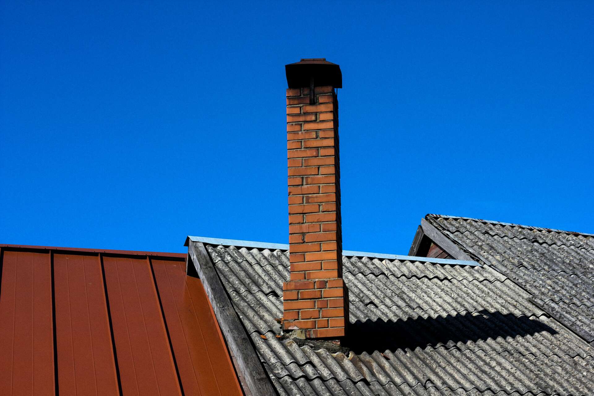 Clean Roof and Chimney Surface Prepared for Flashing Installation