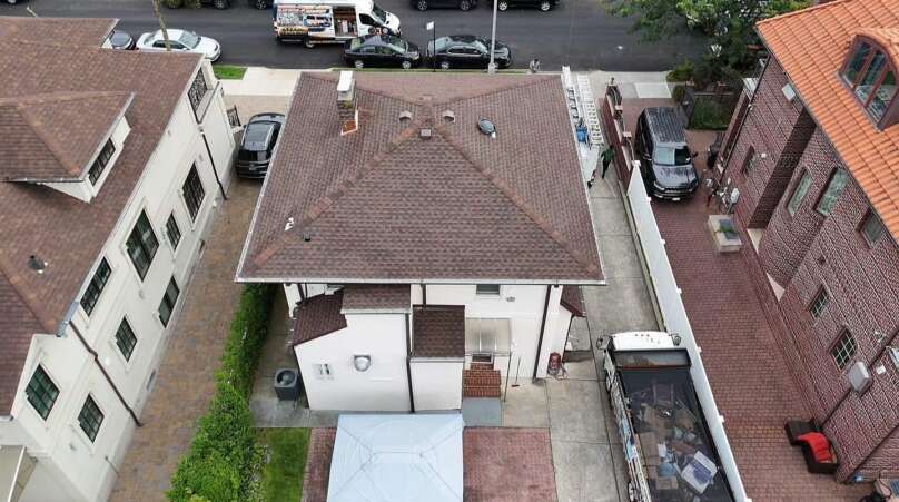 Spanish Tile Roof Replaced with New Shingle & Gutter Installation in Queens Project Shot 1